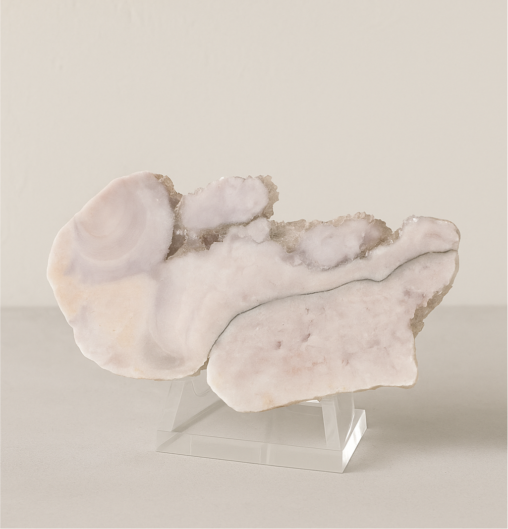 “Polished Pink Amethyst slab from Brazil, approx. 8x5 inches, displayed on a neutral stone surface with soft beige plaster background — luxury natural decor by Luxe Natural Decor.”